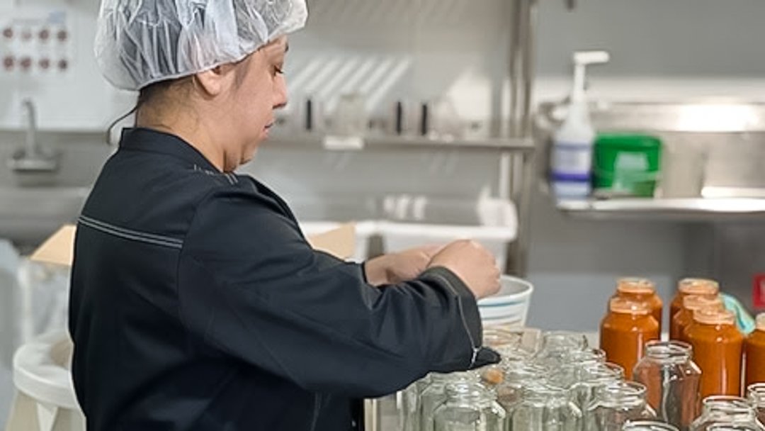 Sonoma Farm Co-Packing Employee Bottles Pasta Sauce for Customer